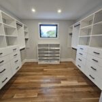 White melamine walk in closet system with black hardware