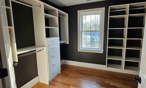 Fresh White Melamine Closet with Warm Brown Walls