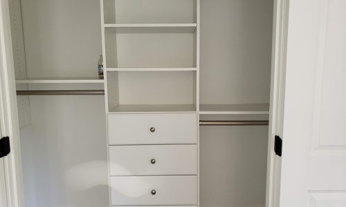 Efficient Reach-In Closet with Built-In Storage Solutions