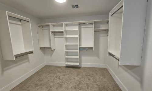 Bright and Airy Large Closet with Custom Storage Solutions