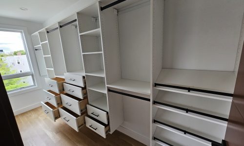 Expansive White Melamine Closet with Sleek Chrome Hardware