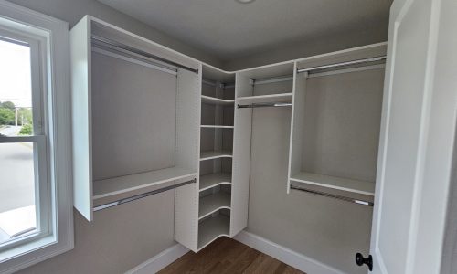 Elegant Small Master Closet in White Melamine with Chrome Accents